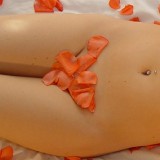 Heidi gets naked in bed with rose petals