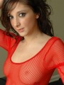 Melanie is showing off her perky tits in a mesh dress