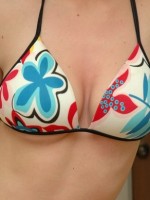 Amys huge boobs are popping out of her bikini top