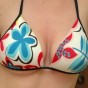 Amys huge boobs are popping out of her bikini top