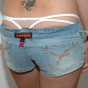 Kalees white thong is peeking out of her little jean shorts