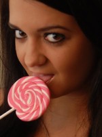 Sexy and very busty Southern Brooke shows off her oral skills on her pink lollipop